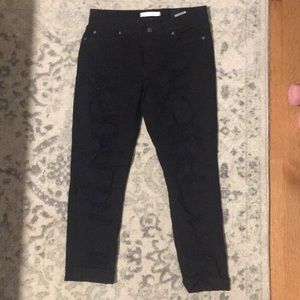 Black cropped jeans with ripped detailing